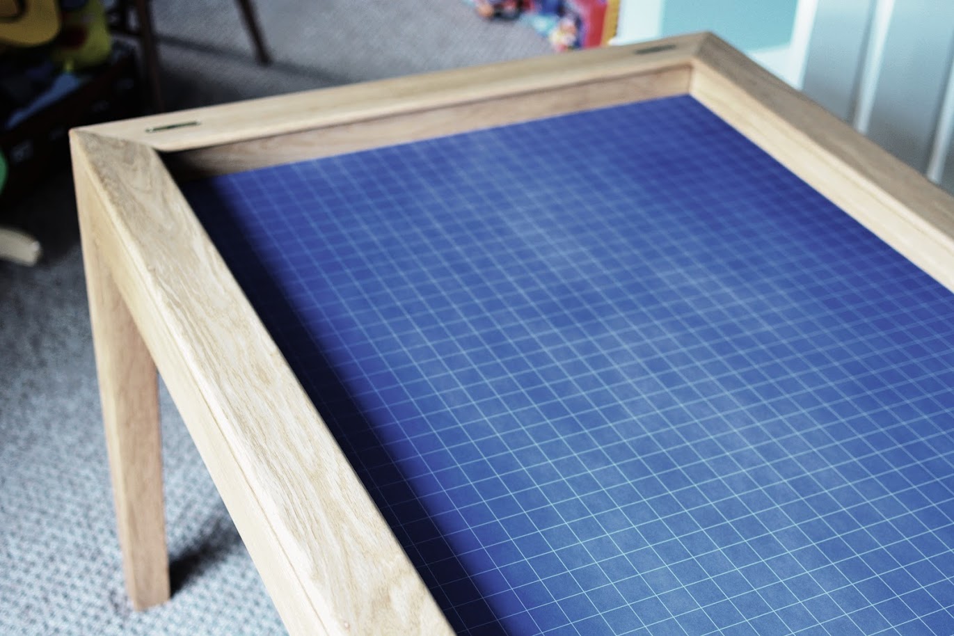 Neoprene vaulted gaming surface below oak dining table top